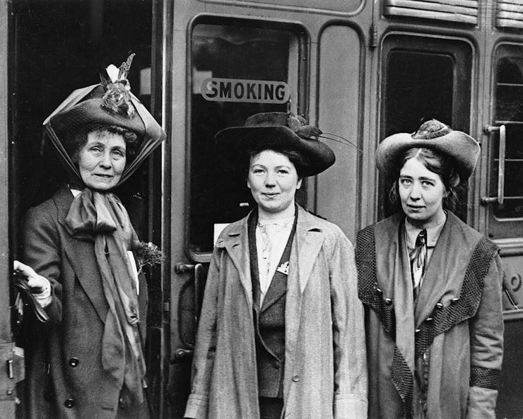 Emmeline Pankhurst (left), Christabel (centre) and Sylvia at Waterloo Station, London on 4th October 1911. WC PD.