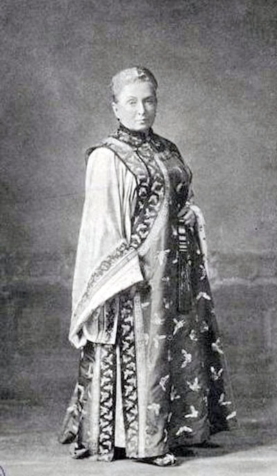 Isabella Bird Bishop wearing a Manchurian gown, 1899. WC PD.