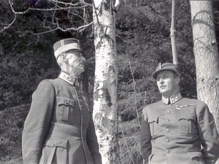 King Haakon VII and Crown Prince Olav seeking shelter on the outskirts of Molde during a German bombing raid on the city in April 1940. WC PD.