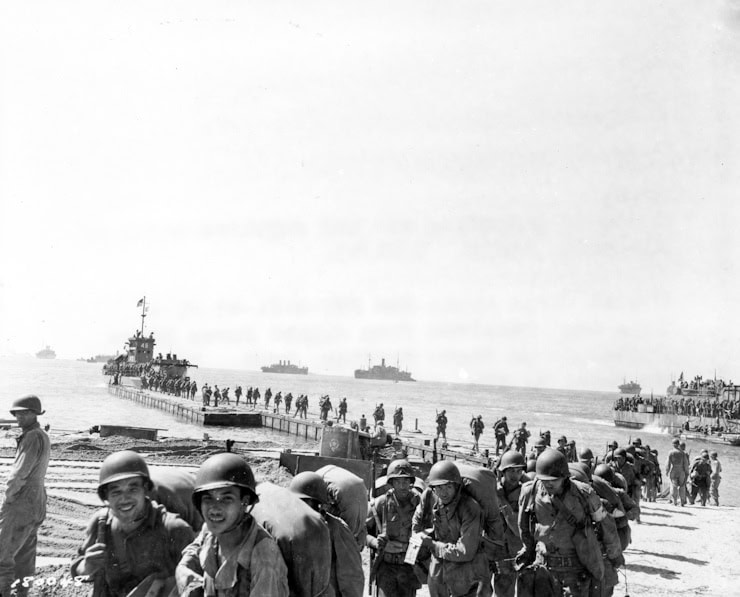 A convoy unloading men and supplies north of Agropoli, Italy. 21 September, 1943. WC PD